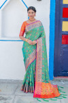 Green color soft banarasi silk saree with meenakari design