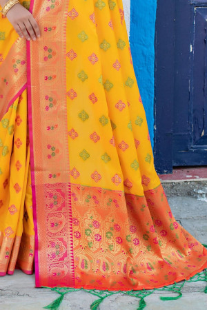 Yellow color soft banarasi silk saree with meenakari design