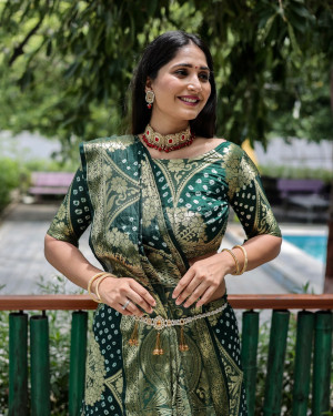 Dark green color pure hand bandhej silk saree with zari weaving work