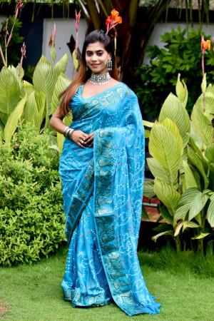 Sky blue color bandhani saree with khadi printed work