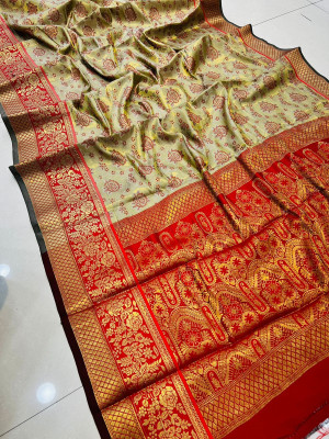 Off white color banarasi silk saree with golden zari weaving work