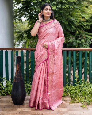 Baby pink color linen silk saree with golden  zari weaving work