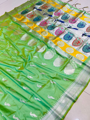 Parrot green color paithani silk saree with  silver zari weaving work