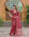 Maroon color hand bandhej silk saree with printed work