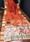 Orange color hand bandhej silk saree with zari weaving work