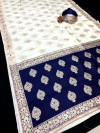 Off white and navy blue color banarasi silk saree with zari weaving work