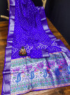 Royal blue color hand bandhej silk saree with zari weaving work