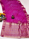 Pink color hand bandhej silk saree with zari weaving work