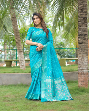 Rama green color hand bandhej silk saree with zari weaving work