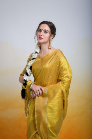 Yellow color tussar silk saree with zari woven work