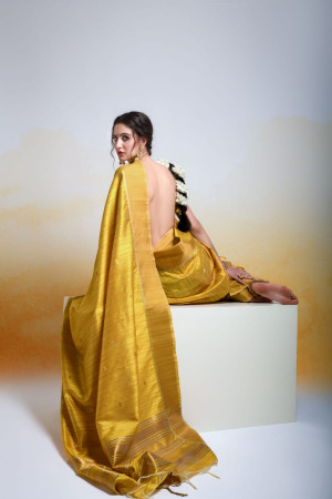 Yellow color tussar silk saree with zari woven work