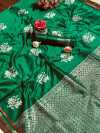 Dark green color soft banarasi silk saree with woven work