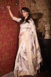 Off white color soft mulberry silk saree with zari woven butta and border
