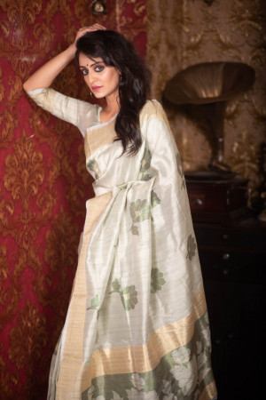 Cream color soft mulberry silk saree with zari woven butta and border