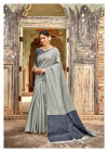 Gray color metallic linen saree with silver zari border
