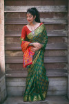 Green color patola silk saree with zari weaving work