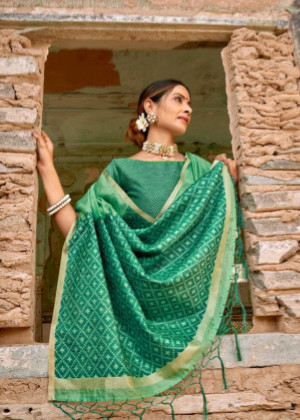 Mint green color metallic linen saree with silver zari border