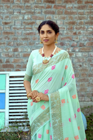 Pista green color soft chanderi cotton saree with contrast woven work