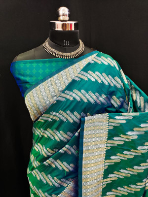 Rama green color soft banarasi silk saree with golden and silver zari work