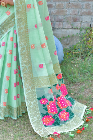 Pista green color soft chanderi cotton saree with contrast woven work