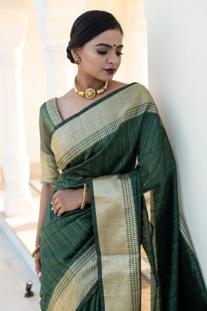 Green color tussar silk saree with zari weaving border