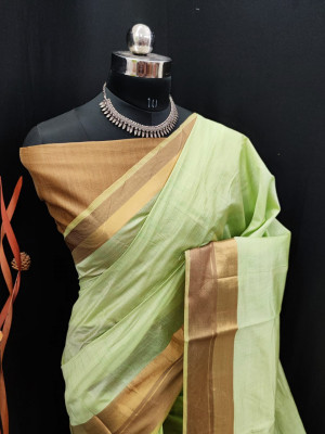 Pista green color soft  silk saree with golden zari border