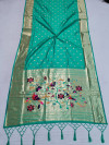 Sea green color paithani silk saree with gold zari border