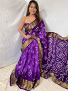Purple color hand bandhej bandhani silk saree with zari weaving work