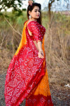 Yellow and red color soft bandhani silk saree with hand bandhej work