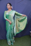Green color muslin silk saree with zari weaving work