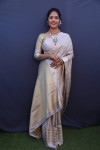 Beige color muslin silk saree with zari weaving work