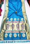 Sky blue color paithani silk saree with gold zari weaving border