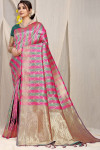 Rani pink and grren color kanchipuram silk saree with zari woven work