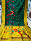 Dark green color paithani silk saree with gold zari weaving work