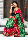 Green and red color bandhani saree with hand bandhej print