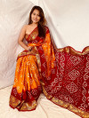 Orange and maroon color hand bandhej bandhani silk saree with zari weaving work