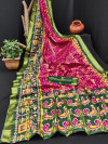 Rani pink and green color cotton saree with patola printed work
