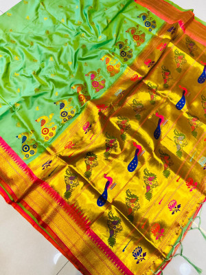 Pista green color paithani silk saree with golden zari weaving work