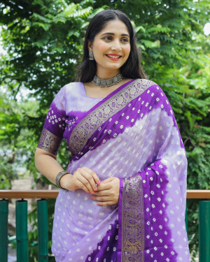 Purple and navy blue color bandhej silk saree with zari weaving work