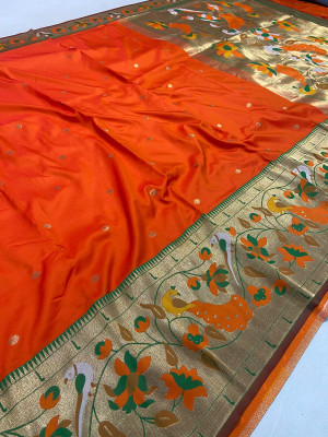 Orange color paithani silk saree with mina zari border