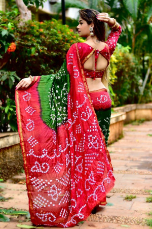 Red and green color soft bandhani silk saree with hand bandhej work