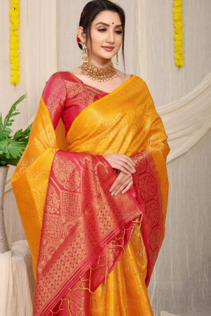 Yellow color kora muslin silk saree with zari weaving work