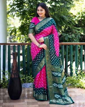Rani pink and green color bandhej silk saree with zari weaving work