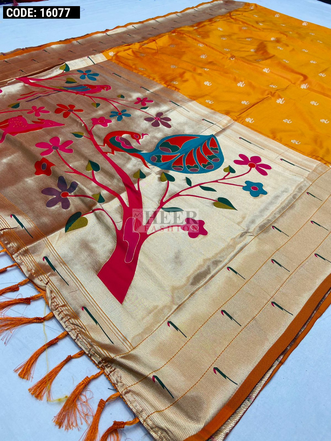 Orange color paithani silk saree with mina weaving zari pallu