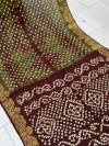 Mahendi green color hand bandhej silk saree with sibori printed work