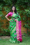 Green color hand bandhej silk saree with bandhani printed work