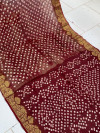 Brown color hand bandhej silk saree with sibori printed work