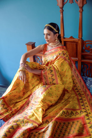 Yellow color patola silk saree with zari weaving work