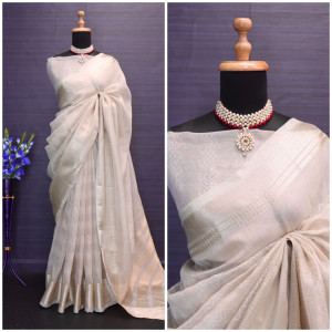 Beige color soft tussar silk saree with zari weaving border
