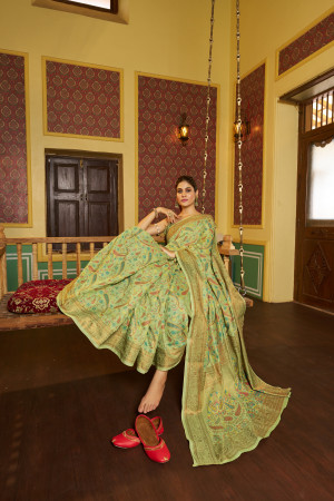 Pista green color soft cotton silk saree with woven design